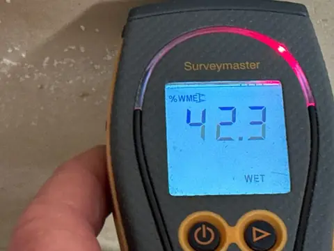 Moisture meter reading WET on a Wet To Dry job