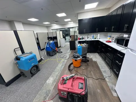 Commercial office break room with a dehumidifier, extractor and air movers running