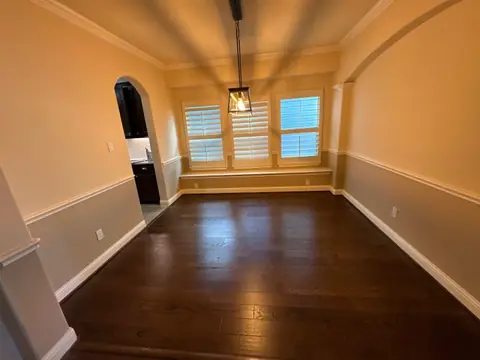 Finished breakfast nook with new wood floors, fresh paint and window seat