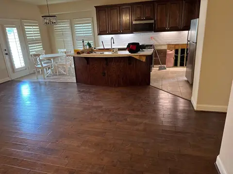 Kitchen and breakfast area with new wood floors and island